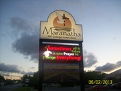 Clouds behind a Church sign
