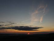 Jet Seperates The Setting Sun.