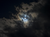 Solar Eclipse Through Cloud