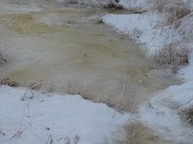 A frozen stream in Legal, AB