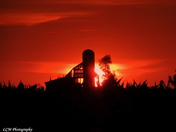 Sunset Through An Old Wood Barn