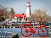 The red bike by the red light house
