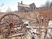 Abandoned wagon wheel house 
