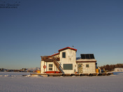 Beautiful houseboat on Yellowknife Bay in Great Slave Lake