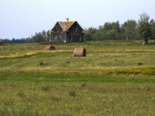 Panorama with an abandoned farmhouse.