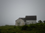 Abandoned home in the fog 