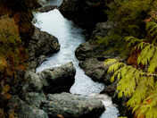 Quiet river breaking through the rocks