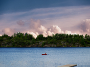 Lone boat on the lake, Muskoka, ON