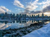 Cityscape view of Vancouver skyline during winter with water reflection