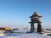 Inukshuk on the top of the hill in Rankin Inlet, Nunavut Canada