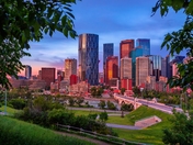 Downtown Calgary At Sunrise Peeking Through Trees