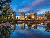 Downtown Calgary Building Reflections In A Park Lake