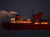 Ship passing by our house at night.