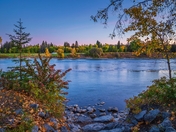 Sunrise Over A Fall Park Riverside