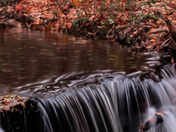 Quiet flows the city's waterfalls in the Fall