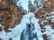 Bluebird sky over a frozen Fall Brook Falls