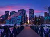 Sunrise Over An Illuminated Bridge Walkway
