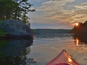Hazy sky with orange sun setting down above Charleston PP. The wildfires effect.