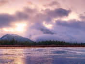 Sunrise Clouds Over Winter Mountains