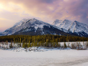 Morning Clouds Over Snowy Mountains