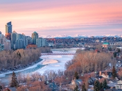 Sunrise Over City And Mountains
