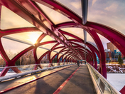Walking Through A Sunlit Peace Bridge