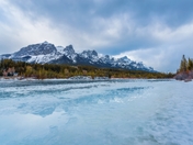 Icy River Through Canmore Mountains