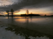 Sunset over frozen fields