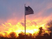 A fireball of a sunset as seen from our farmers porch.