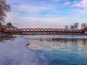 Peace Bridge Over A Wintry Bow River