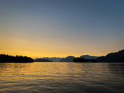 Sunset scene over mountains near Thetis Island with reflection on water