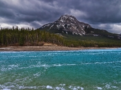 Moody Clouds Over Mountains At Barrier Lake