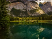 Moody Sunlit Mountain Reflections