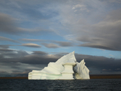 Stranded tabular iceberg and ice near evening in arctic landscape, near Pond Inlet, Nunavut