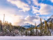 Sun Glowing Over Wintry Canmore Mountains