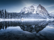 The reflection on Lake Louise during the blue hour