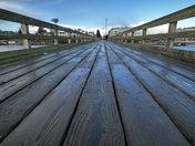 Low angle of wooden fishing pier in Sidney, British Columbia