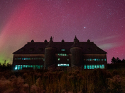 Cattle barn under the northern lights