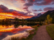 Cloudy Sunrise Glowing Over Quarry Lake In Canmore