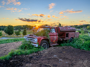 Abandoned Fire Truck Reclaimed by Nature on a Rural Ontario Farm at Sunset