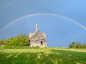 Rainbow Over an Abandoned Cabin in Rumsey, Alberta