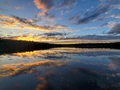 sunset reflection on calm lake