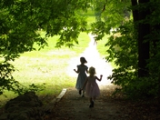 Children skipping out of the woods