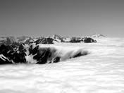 Clouds pouring over Cascade Pass
