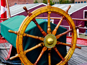 Polished Oak Wheel at the helm of the HMS Acadia in Halifax Harbour