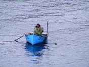 Fishermen hold flowers