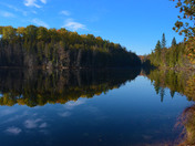 remote lake/pond found in the forest in the fall