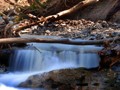 Spring runoff creates small waterfall