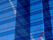 Urban Reflections - Crane against building in Toronto