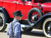 hutterite boy, red car